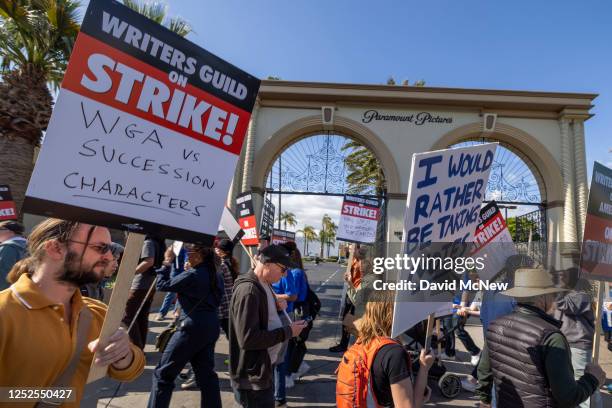 People picket outside of Paramount Pictures on the first day of the Hollywood writers strike on May 2, 2023 in Los Angeles. Scripted TV series,...