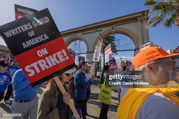 People picket outside of Paramount Pictures on the first day of the Hollywood writers strike on May 2, 2023 in Los Angeles. Scripted TV series,...