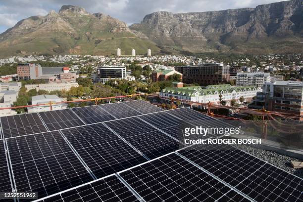 General view of solar panels on top of the Hemp Hotel in Cape Town on April 25, 2023. - Twelve floors, a breathtaking view over Table Mountain and a...