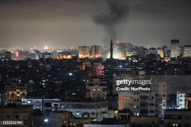 Smoke rises above buildings in Gaza City on the Palestinian enclave on May 3, 2023. - The Israeli military traded fire with Gaza militants on May 2,...