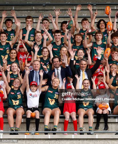 Jeremy Rockliff, Gillon McLachlan and Richard Marles pose with local footballers during the AFL Tasmanian Team Announcement at North Hobart Oval on...