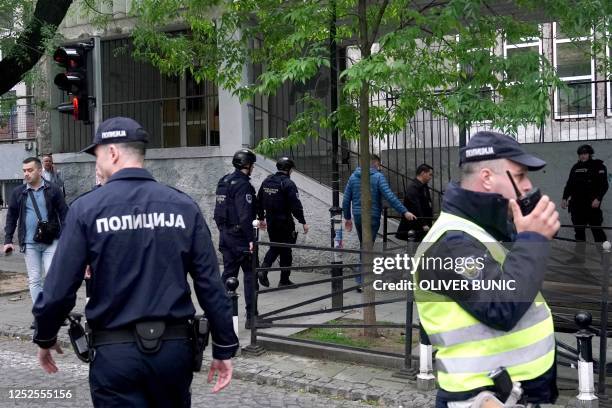 Police officers arrive following a shooting at a school in the capital Belgrade on May 3, 2023. - Serbian police arrested a student following a...