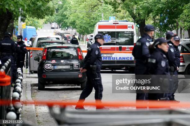 Ambulances and police officers arrive following a shooting at a school in the capital Belgrade on May 3, 2023. - Serbian police arrested a student...