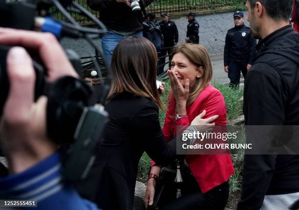 Parent cries following a shooting at a school in the capital Belgrade on May 3, 2023. - Serbian police arrested a student following a shooting at an...