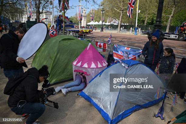 Wellwishers camping out along the procession route are pictured with the their tents and camping chairs on The Mall, in central London, on May 3 as...