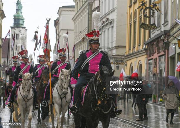 May 1, 2023: State and city representatives, army, veterans, law enforcement, and residents walk from Wawel Hill through Krakow's Old Town...