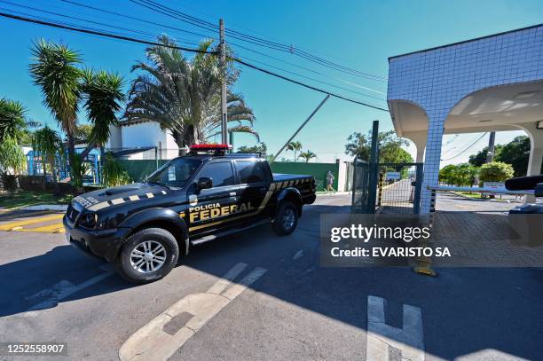 Vehicle of the Federal Police leaves the condominium where Brazilian ex-president Jair Bolsonaro lives, after allegedly searching his home as part of...