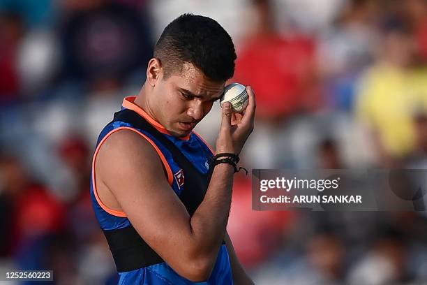 Mumbai Indians' Arjun Tendulkar practices before the start of the Indian Premier League Twenty20 cricket match between Punjab Kings and Mumbai...