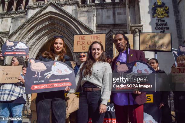Personality Lucy Watson, TV presenter Megan McCubbin and writer Benjamin Zephaniah hold 'Justice for chickens' placards during the demonstration....
