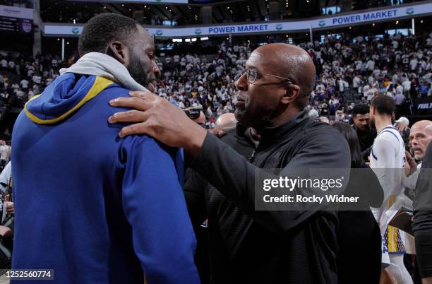 Head Coach Mike Brown of the Sacramento Kings and Draymond Green of the Golden State Warriors hug after Round 1 Game 7 of the 2023 NBA Playoffs on...