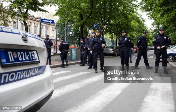 Police officers block a street next to the 'Vladislav Ribnikar' elementary school on May 3, 2023 in Belgrade, Serbia. At least eight students and a...