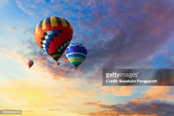 low angle view of hot air balloons against blue sky - hot air balloon imagens e fotografias de stock
