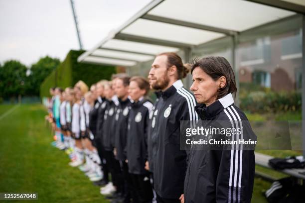 Headcoach Bettina Wiegmann and staff members of U15 Girls Germany line up during the national anthem prior to the International Friendly match...