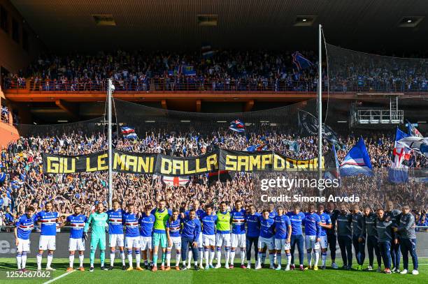 Players and staff of Sampdoria pose for a picture under a giant banner that says "Keep hands off Sampdoria" prior to kick-off in the Serie A match...