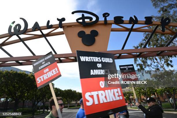 Writers walk the picket line on the second day of the television and movie writers' strike outside Disney Studios in Burbank, California on May 3,...