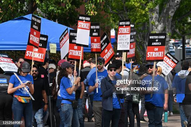 Writers walk the picket line on the second day of the television and movie writers' strike outside Disney Studios in Burbank, California on May 3,...