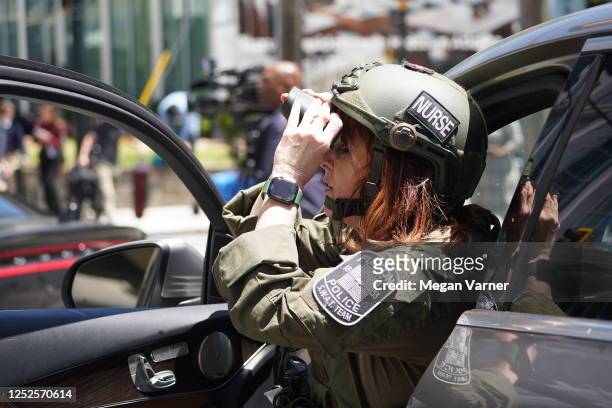 Nurse with the Fulton County police SWAT team works at the scene of a shooting near a medical facility on May 3, 2023 in Atlanta, Georgia. Police say...