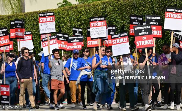 Writers walk the picket line on the second day of the television and movie writers' strike outside of Paramount Studios in Los Angeles, California on...
