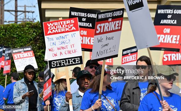 Writers walk the picket line on the second day of the television and movie writers' strike outside of Paramount Studios in Los Angeles, California on...