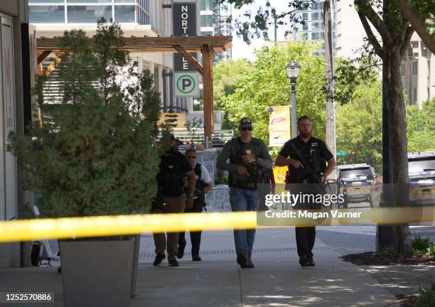 Police officers work the scene of a shooting near a medical facility on May 3, 2023 in Atlanta, Georgia. Police say four people were injured and one...