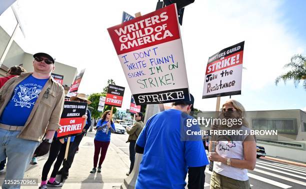 Writers walk the picket line on the second day of the television and movie writers' strike outside of Paramount Studios in Los Angeles, California on...