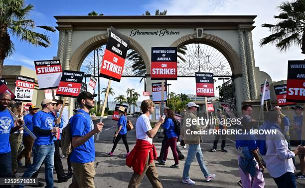 Writers walk the picket line on the second day of the television and movie writers' strike outside of Paramount Studios in Los Angeles, California on...