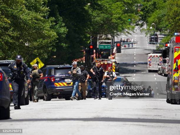 Police officers work the scene of a shooting near a medical facility on May 3, 2023 in Atlanta, Georgia. Police say four people were injured and one...