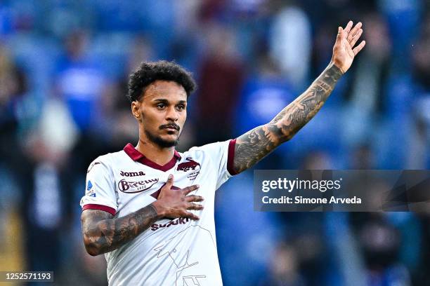 Valentino Lazaro of Torino apologizes with Sampdoria's fans after Pietro Pellegri of Torino has scored a goal and provoked them during the Serie A...