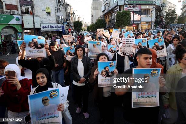People gather to demonstrate against the conditions in Israeli prisons following the death of Palestinian prisoner Khader Adnan who died after an 87...