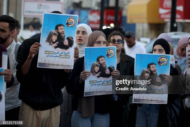 People gather to demonstrate against the conditions in Israeli prisons following the death of Palestinian prisoner Khader Adnan who died after an 87...