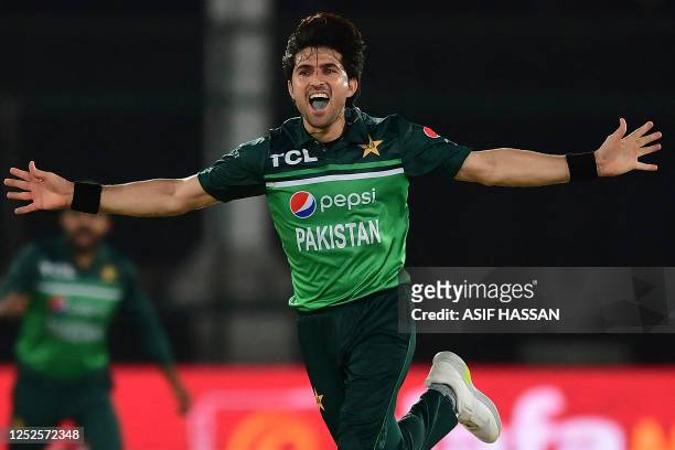 Pakistan's Mohammad Wasim celebrates after taking the wicket of New Zealand's captain Tom Latham during the third one-day international cricket match...
