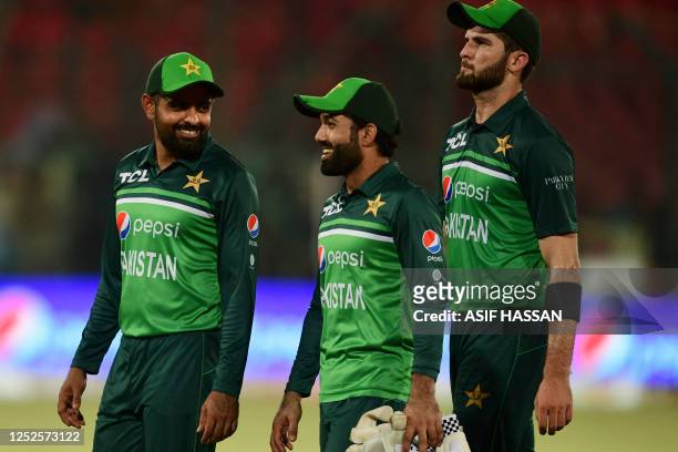 Pakistan's captain Babar Azam and teammates celebrate after winning the third one-day international cricket match between Pakistan and New Zealand at...