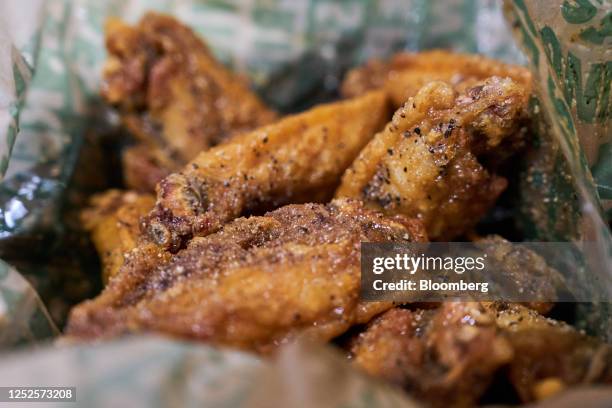 Chicken wings at a Wingstop restaurant in the Brooklyn borough of New York, US, on Wednesday, May 3, 2023. Wingstop Inc. Is scheduled to release...