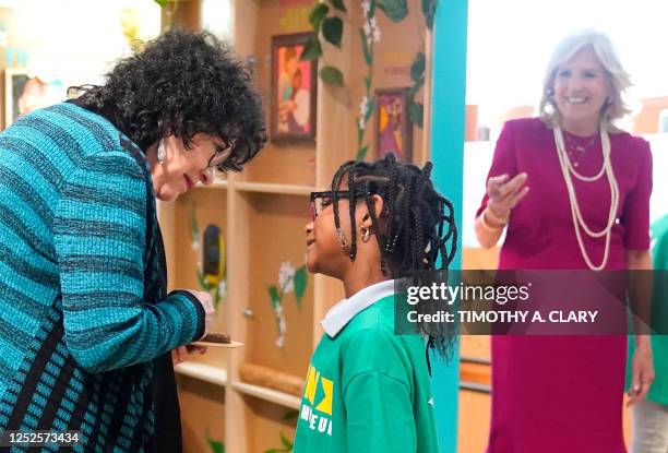 Supreme Court Justice Sonia Sotomayor speaks with a pupil from PS 55 at the Bronx Children's Museum in New York on May 3, 2023 as US First lady Jill...