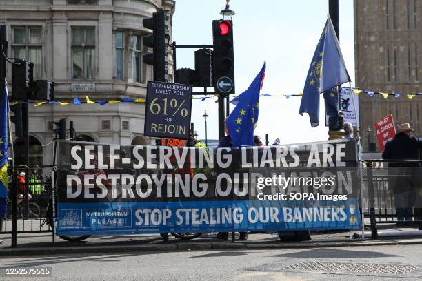 Anti Brexit protesters display a large banner in front of Big Ben in Westminster, London.