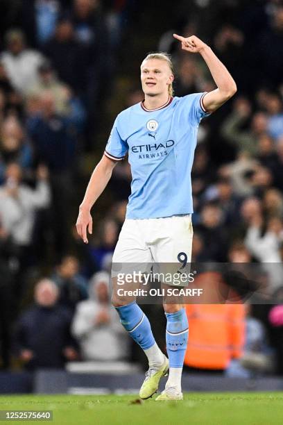 Manchester City's Norwegian striker Erling Haaland celebrates after scoring his team second goal during the English Premier League football match...