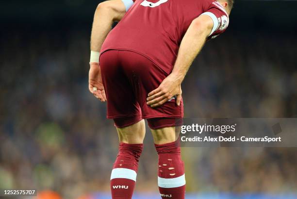 West Ham United's Vladimir Coufal clutches his right hamstring during the Premier League match between Manchester City and West Ham United at Etihad...