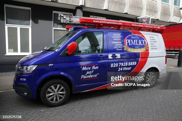 Pimlico plumbers van parked on a road in London.