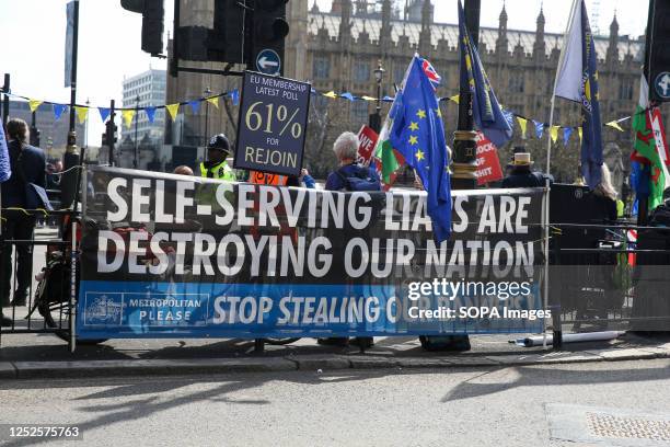 Anti Brexit protesters display a large banner in front of Big Ben in Westminster, London.