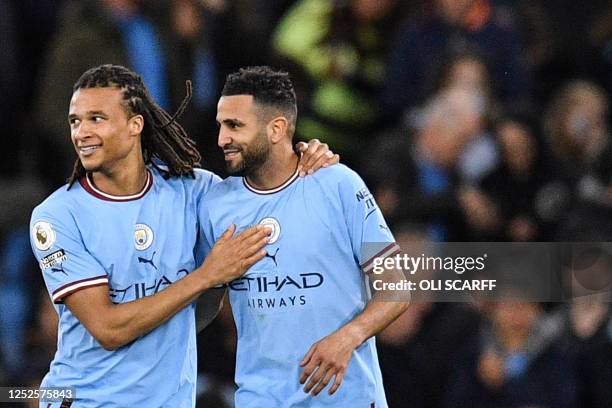 Manchester City's Dutch defender Nathan Ake celebrates after scoring his team first goal during the English Premier League football match between...