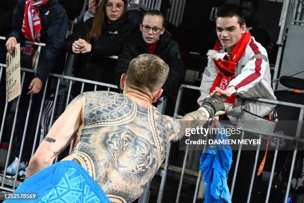 Brest's Dutch goalkeeper Marco Bizot gifts his jersey to a supporter after the French L1 football match between Stade Brestois 29 and FC Nantes at...