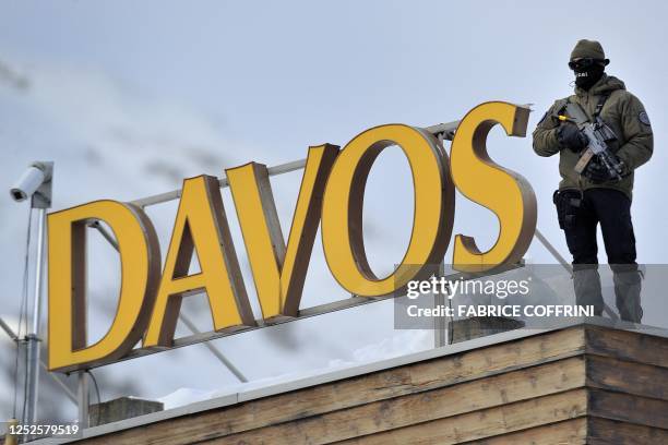 Sniper stands on the roof of the Congress Center on January 25, 2011 on the eve of the World Economic Forum annual meeting in Davos. Switzerland has...