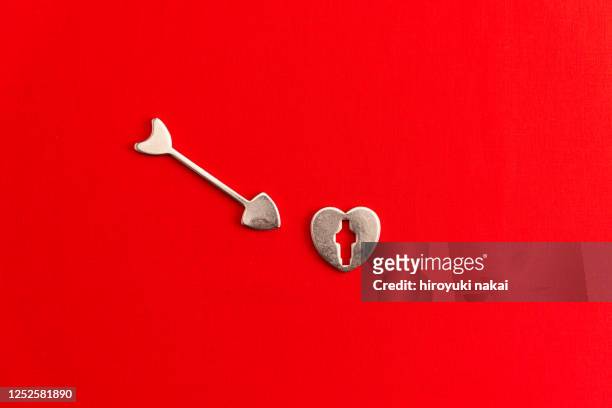 hearts and bows and arrows - cupid stock-fotos und bilder