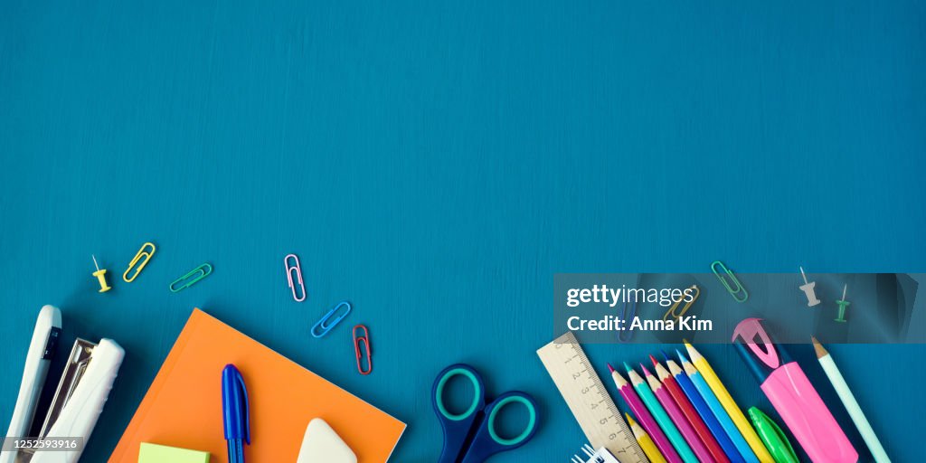 School supplies on blue background