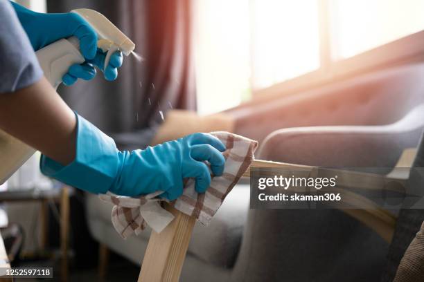 female housekeeping big cleanning house and surface protect spread of covid-19 (coronavirus) at home - clean home stock pictures, royalty-free photos & images