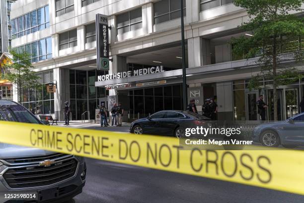 Police officers work the scene of a shooting at a Northside Hospital medical facility on May 3, 2023 in Atlanta, Georgia. Police say one person was...