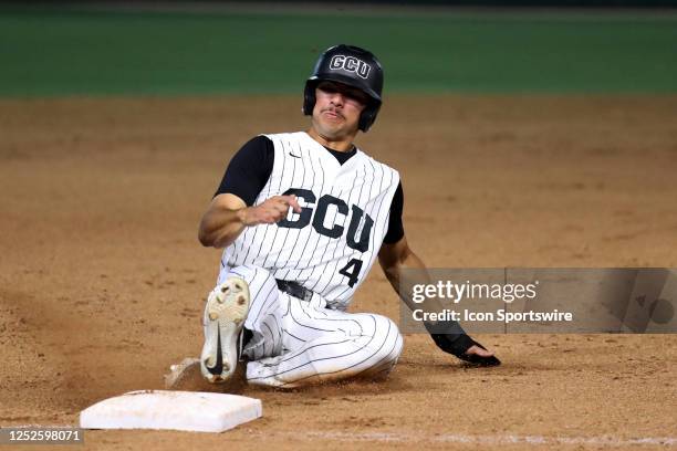 Grand Canyon catcher Tyler Wilson slides into third base during a College Baseball game between the Arizona Wildcats and the Grand Canyon Lopes on...