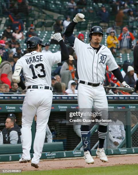 Eric Haase of the Detroit Tigers celebrates with teammate Zach McKinstry after hitting a solo home run against the New York Mets during the second...