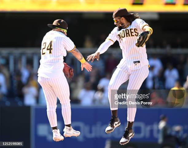 Rougned Odor of the San Diego Padres and Fernando Tatis Jr. #23 celebrate after the Padres beat the Cincinnati Reds 7-1 in a baseball game May 3,...
