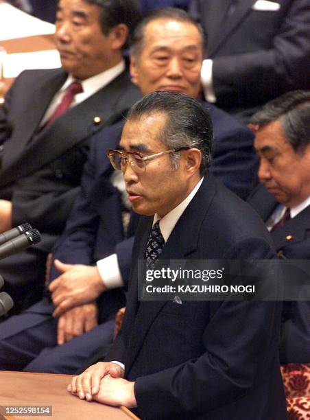 Japanese Prime Minister Keizo Obuchi answers a question during the Budget Committee "question time" session at the House of Representatives at the...